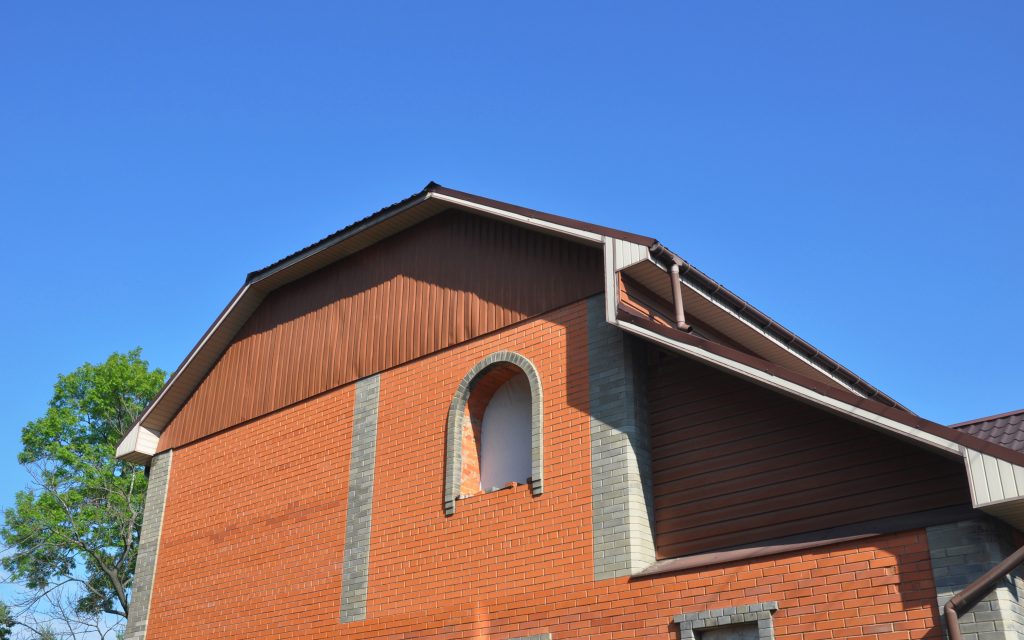 Mansard roofs, like the one pictured, are very popular roof types for residential roofing.