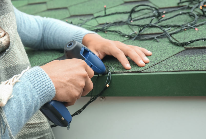 When hanging holiday lights on your home, use light clips from the hardware store rather than staple guns or the like, which can cause roof damage on your Chattanooga home.